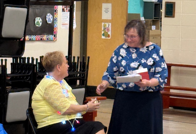 A photo of the 2025 Golden Apple Award recipient