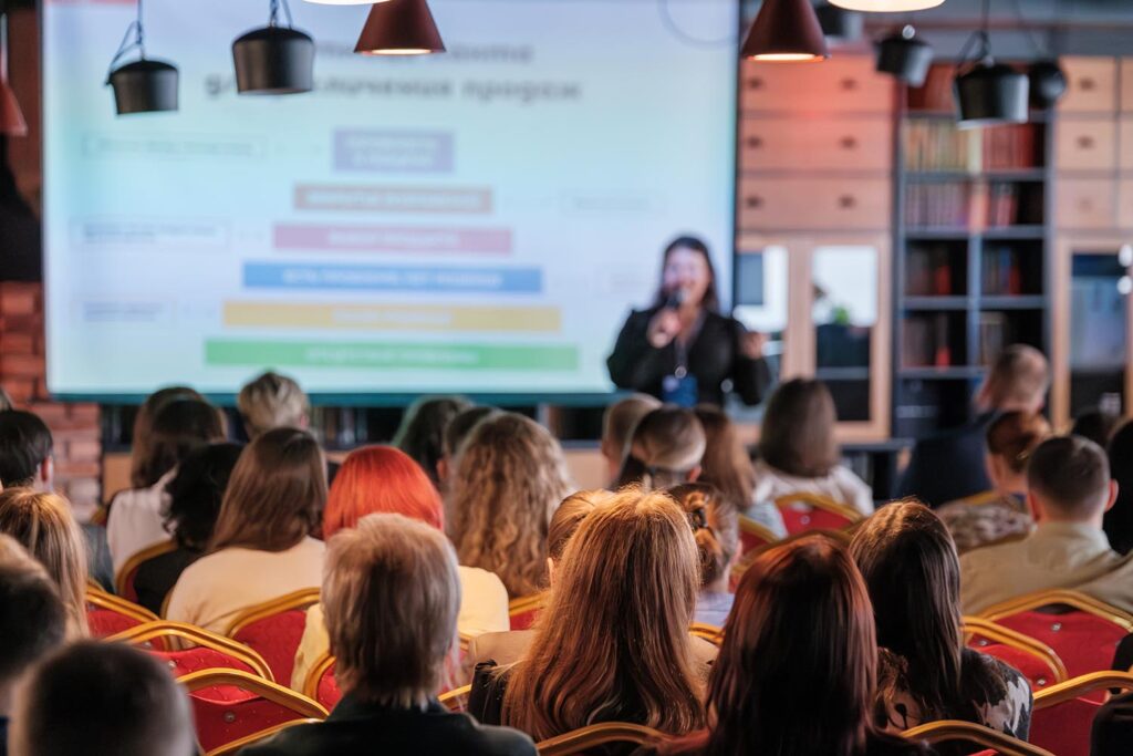 A photo of an audience attending a business presentation